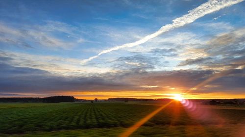 Scenic view of landscape against sky during sunset