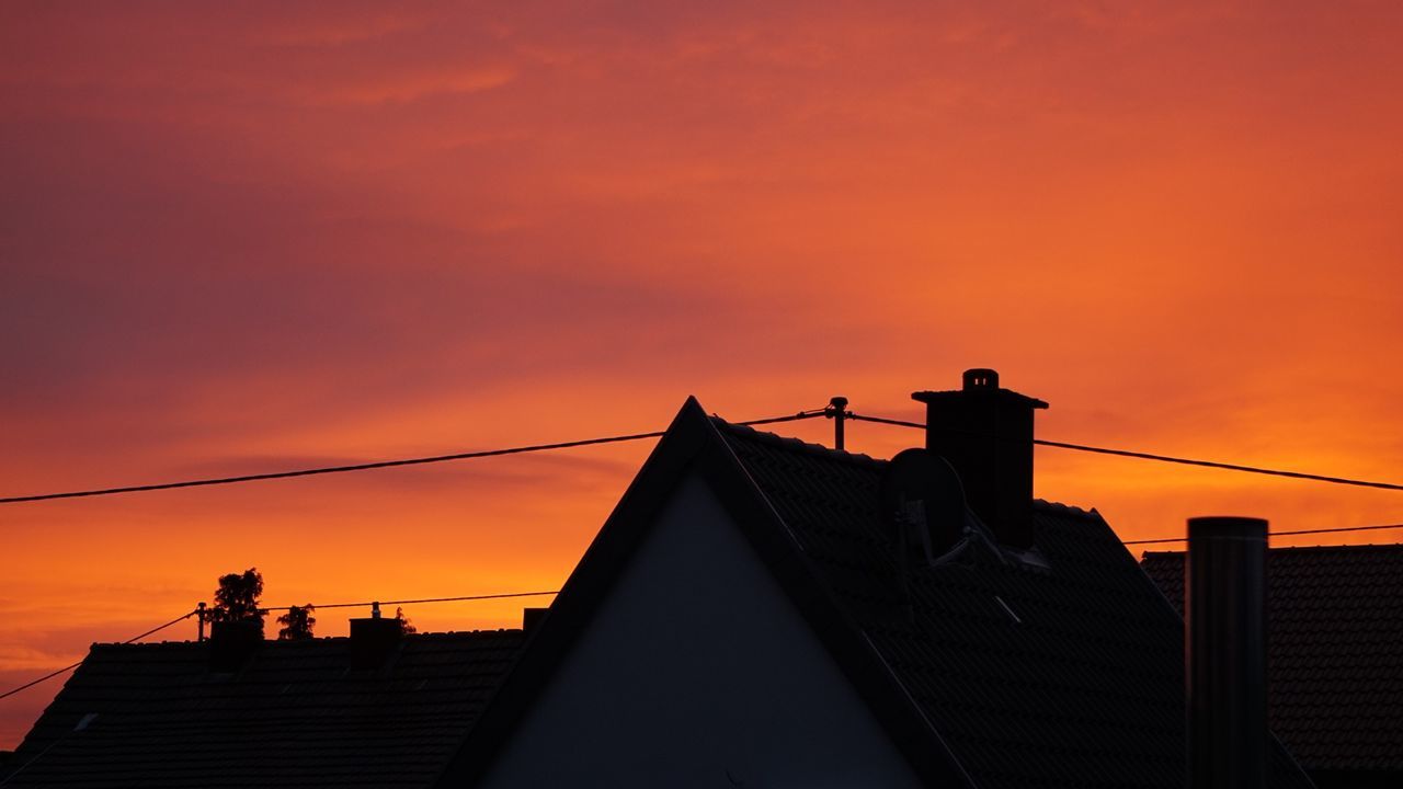 sunset, sky, architecture, orange color, built structure, silhouette, building exterior, nature, building, cloud - sky, outdoors, no people, roof, city, low angle view, connection, railing, beauty in nature, communication, place, location
