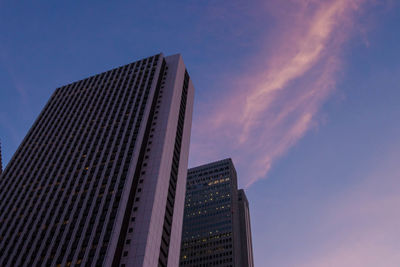 Low angle view of modern buildings against sky