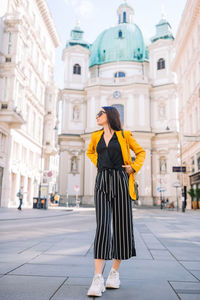 Full length of woman standing in city