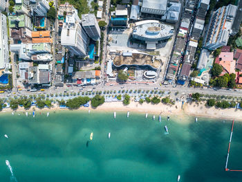 Aerial view of city by sea