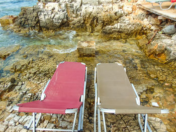 High angle view of empty chairs and table