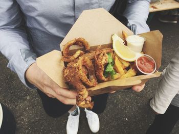 High angle view of man eating food