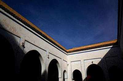 Low angle view of historical building against blue sky