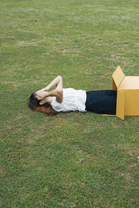 Woman lying on field