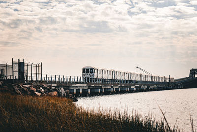 View of a train crossing the bridge over jamaica bay in the queens, new york. subway in ny outside