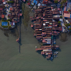 High angle view of river amidst buildings in city