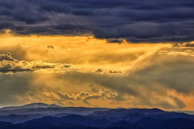 Scenic view of dramatic sky during sunset