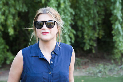 Portrait of young woman wearing sunglasses