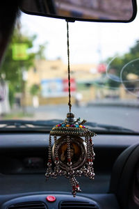 Close-up of lighting equipment hanging from car