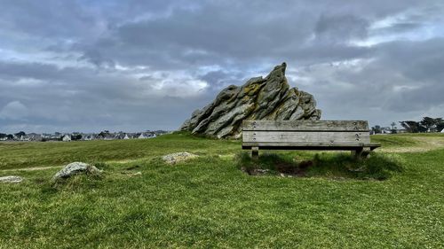 Built structure on field against sky