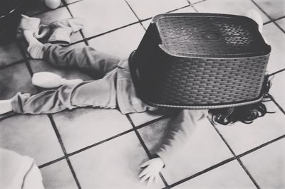 Low section of man sitting on floor