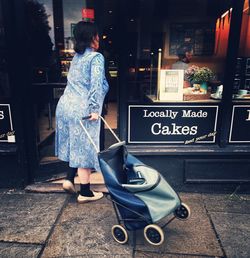 Rear view of man standing on road