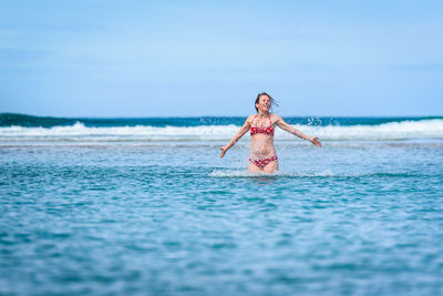 Portrait of young woman in sea