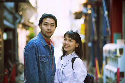 Portrait of couple standing outdoors