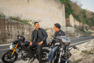 Man riding motorcycle on road