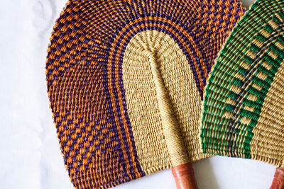 Close-up of colorful hand fans