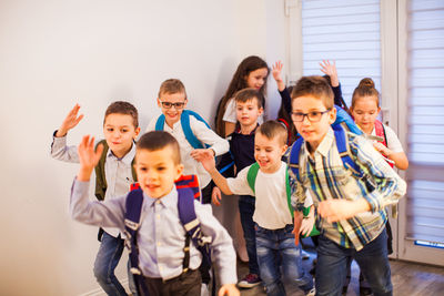 Group of people against wall