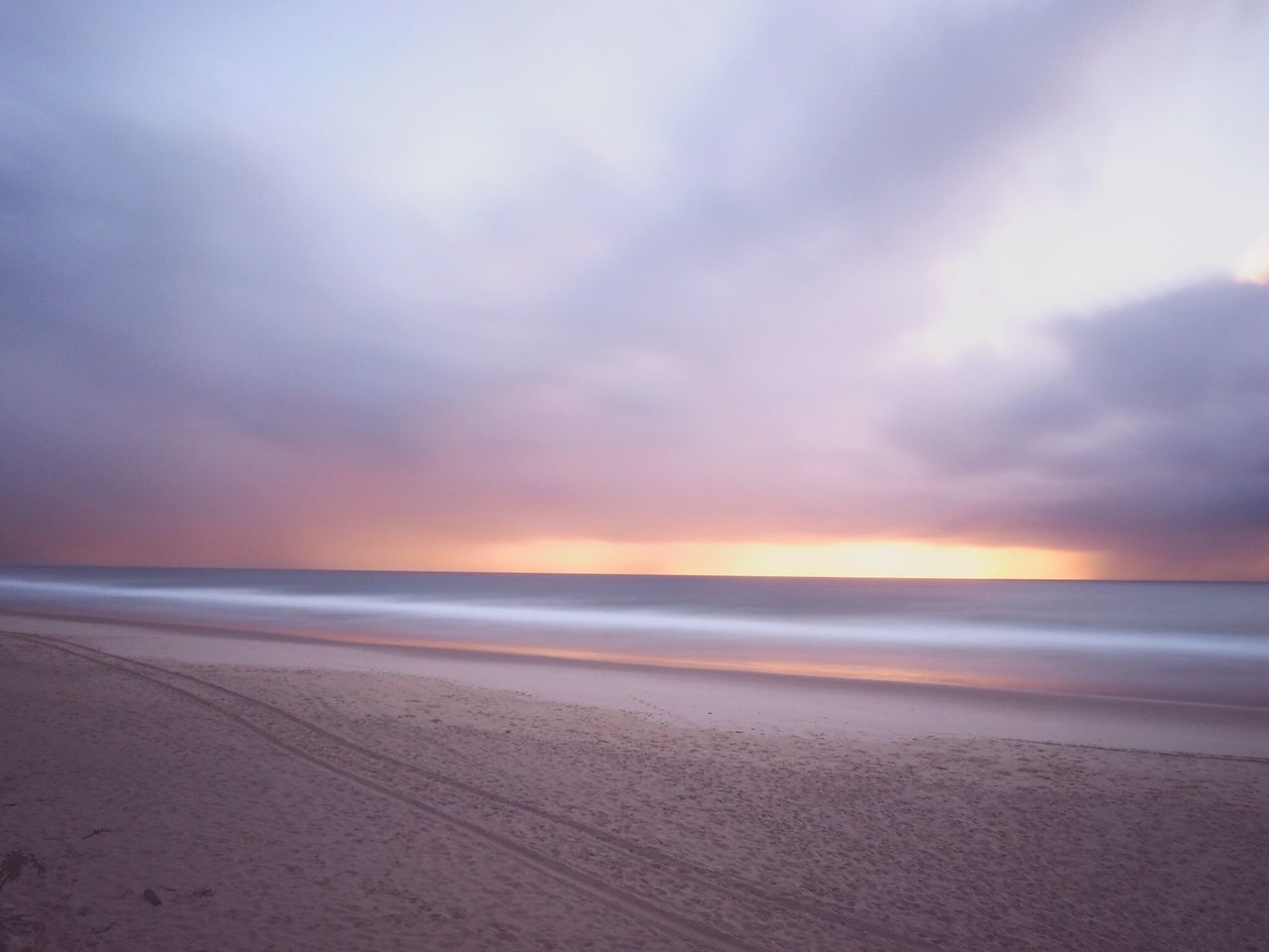 sea, beach, horizon over water, sky, water, shore, scenics, tranquil scene, tranquility, beauty in nature, cloud - sky, sand, sunset, nature, idyllic, cloudy, cloud, coastline, wave, outdoors