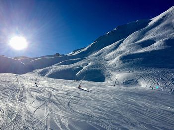 Scenic view of snowcapped mountain against sky