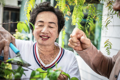 Portrait of smiling man and woman outdoors