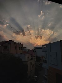 High angle view of buildings against sky at sunset