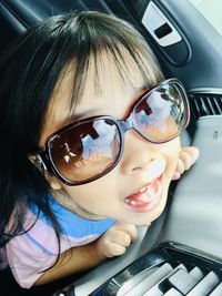 Close-up portrait of a girl in car