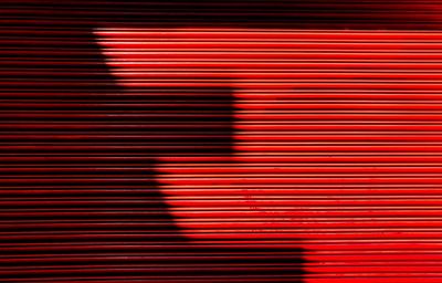 Full frame shot of closed red shutter