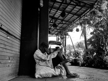 Man sitting in corridor