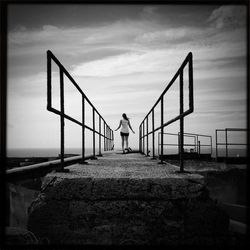 Silhouette of woman standing by sea