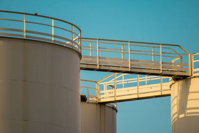 Low angle view of factory against clear sky