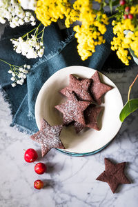 High angle view of star shaped cookies in bowl on table