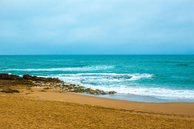 Scenic view of beach against sky