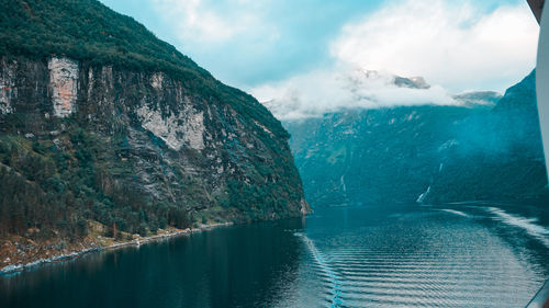 Panoramic view of sea and mountains against sky