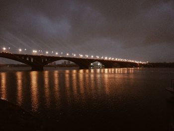 Illuminated suspension bridge at night