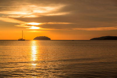 Scenic view of sea against orange sky