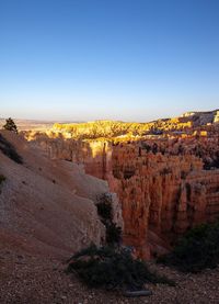 Scenic view of rock formations against sky