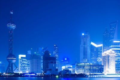 Illuminated buildings in city at night