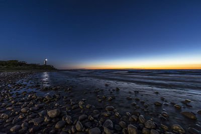 Scenic view of sea against sky at night