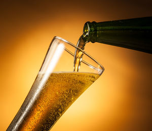 Close-up of beer bottle against black background