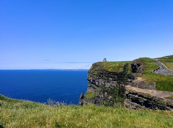 Scenic view of sea against clear blue sky