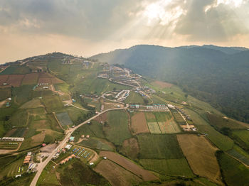 Aerial view of agricultural landscape against sky