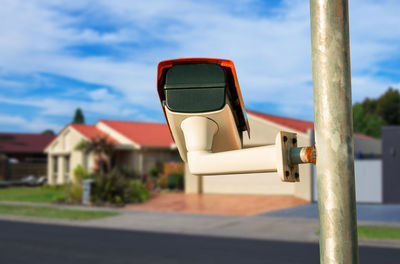 Close-up of vintage car on road against sky