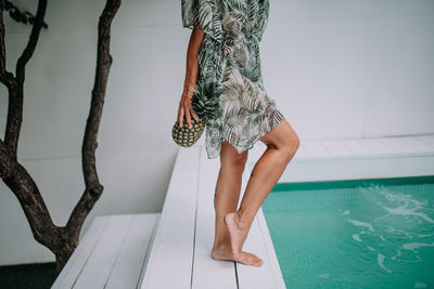 Low section of woman in swimming pool