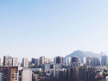 Buildings against clear sky