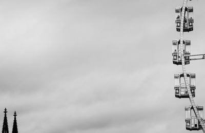 Low angle view of communications tower against sky