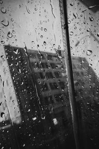 Raindrops on glass window during rainy season