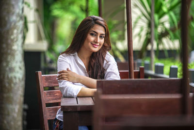 Portrait of young woman using mobile phone