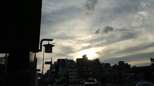 Buildings in city at sunset