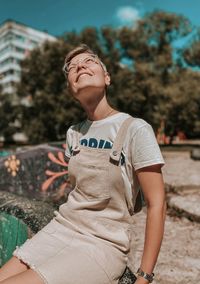 Full length of smiling girl standing outdoors